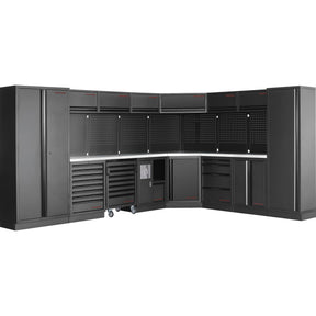 A modern, corner L-shaped workshop storage system in sleek black, featuring multiple cabinets, deep drawers, and perforated panels for tool organization, with a sturdy workbench surface and casters for mobility, available from toprools.com as part of their premium Kraftwerk and King Tony collections.